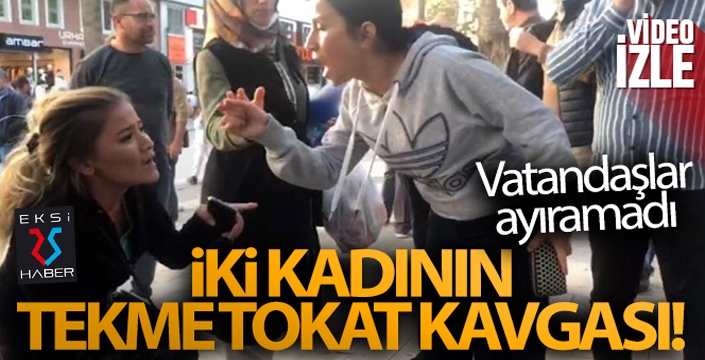 İki kadın onlarca kişinin bakışları arasında tekme tokat kavga etti