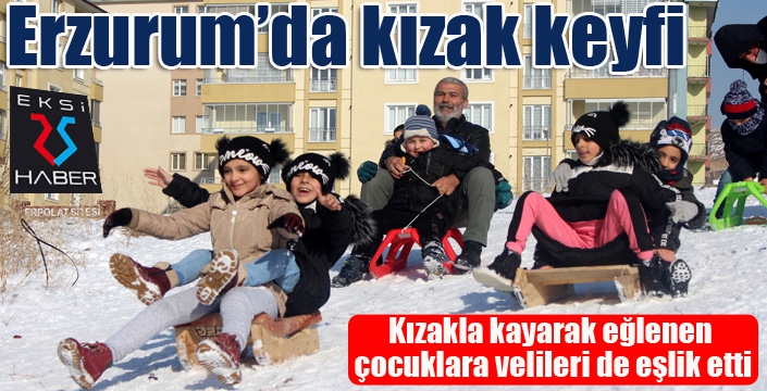 Kızakla kayarak eğlenen çocuklara velileri de eşlik etti