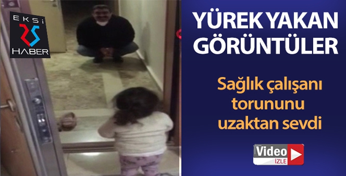 Sağlık çalışanı, kendisine sarılmak isteyen torununu uzaktan sevdi